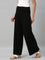 Women Solid Black Viscose Mid Rise Knit Palazzos