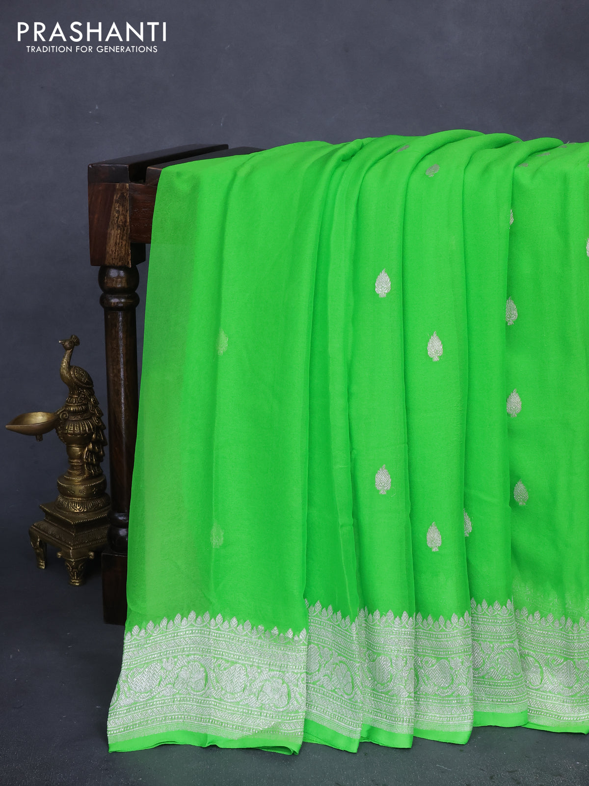 Banarasi chiffon silk saree light green with silver zari woven buttas and silver zari woven border
