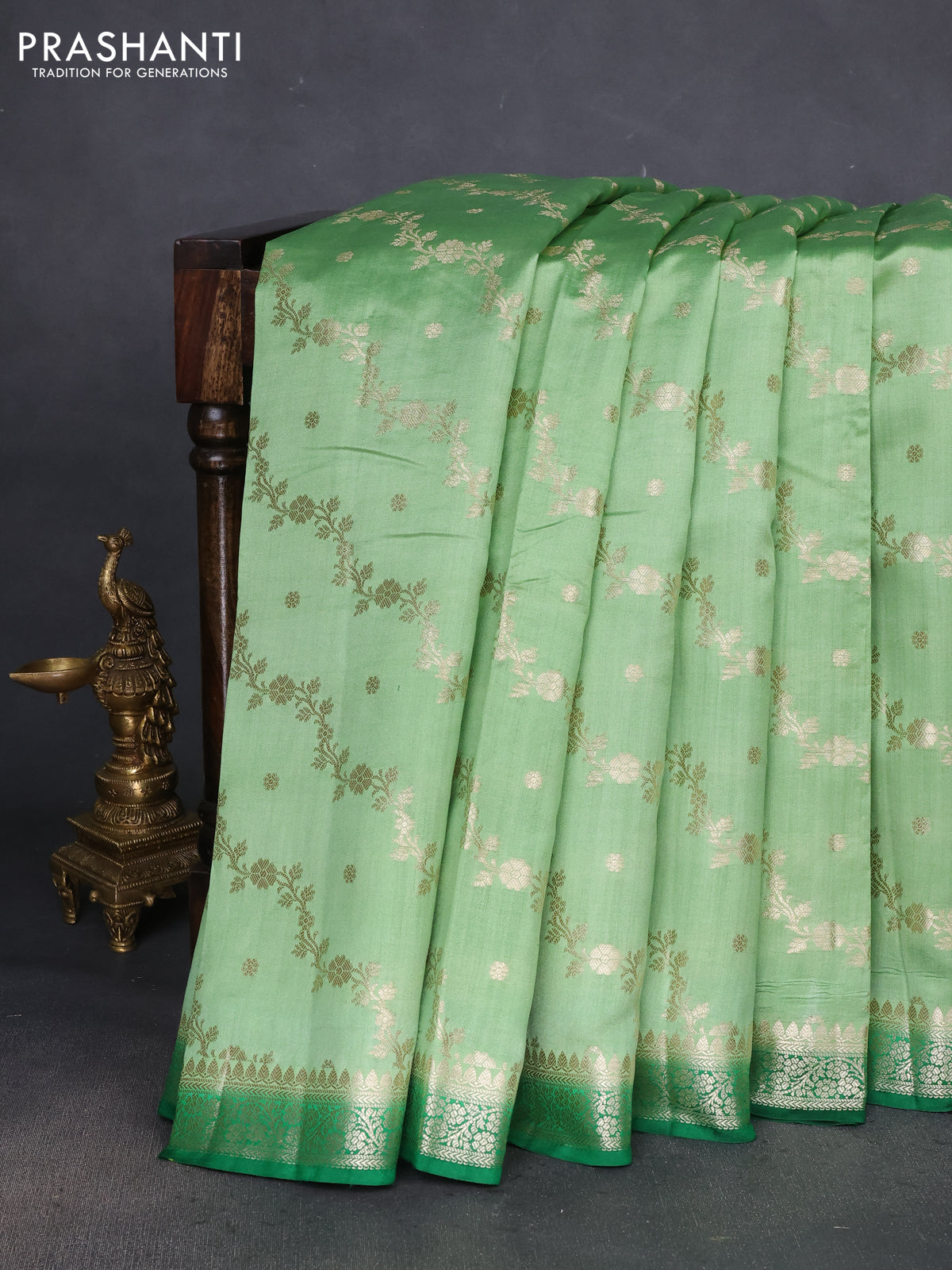 Chiniya silk saree pista green and green with allover zari weaves and zari woven border