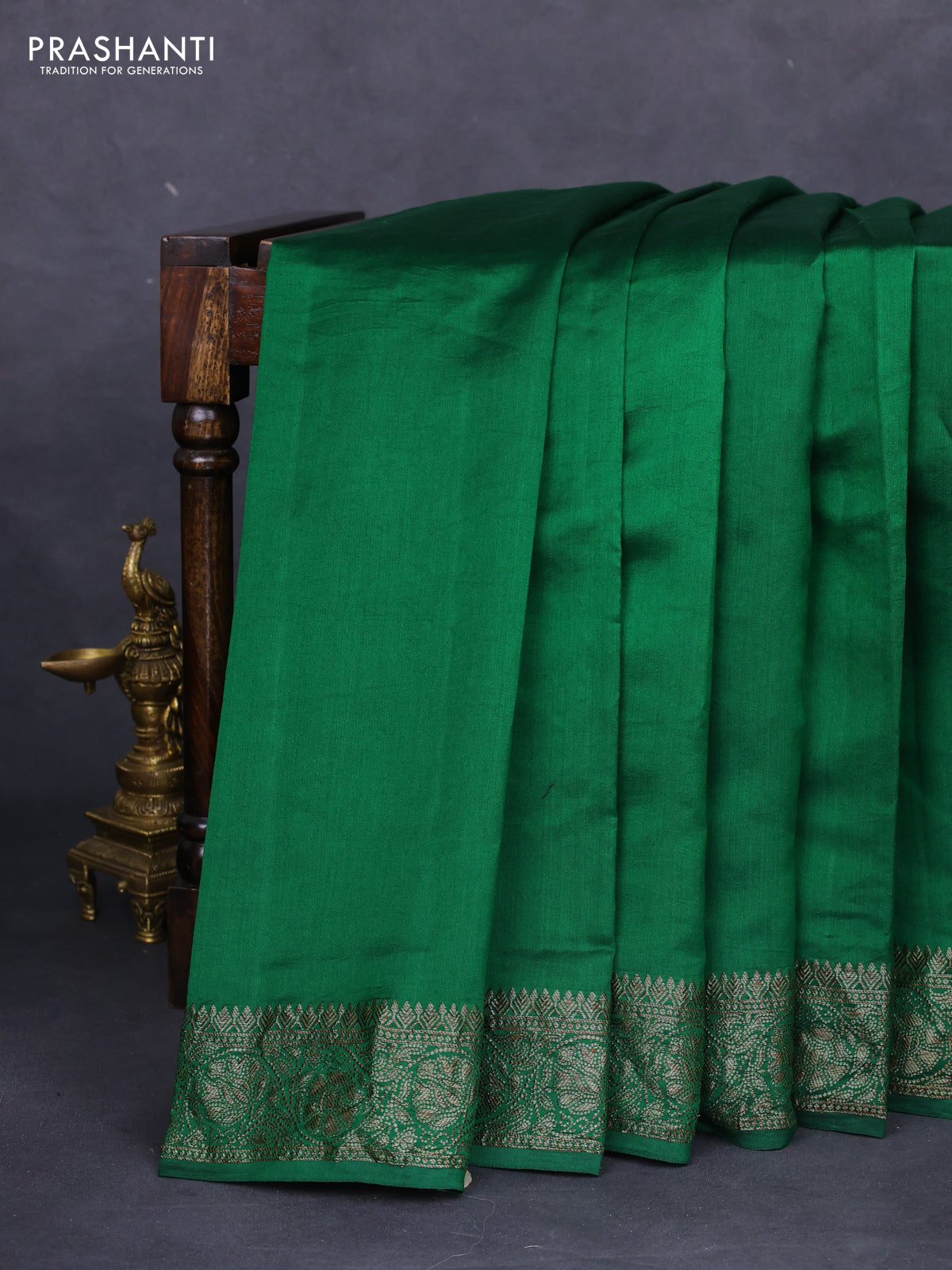 Chiniya silk saree green with plain body and woven border