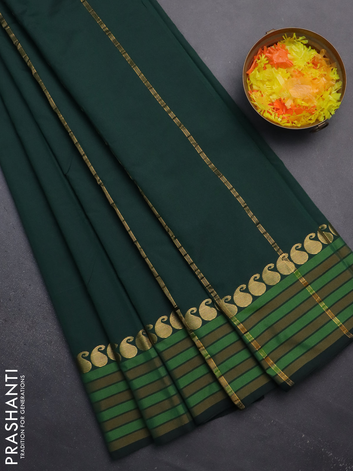 Arani semi silk saree bottle green and mustard yellow with plain body and paisley zari woven simple border
