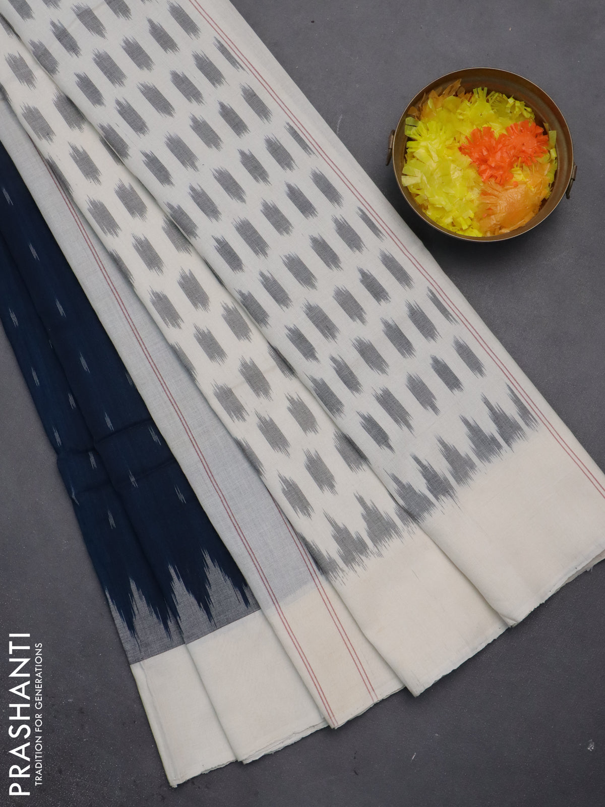 Ikat cotton saree peacock blue and off white with allover ikat butta weaves and temple deision simple border