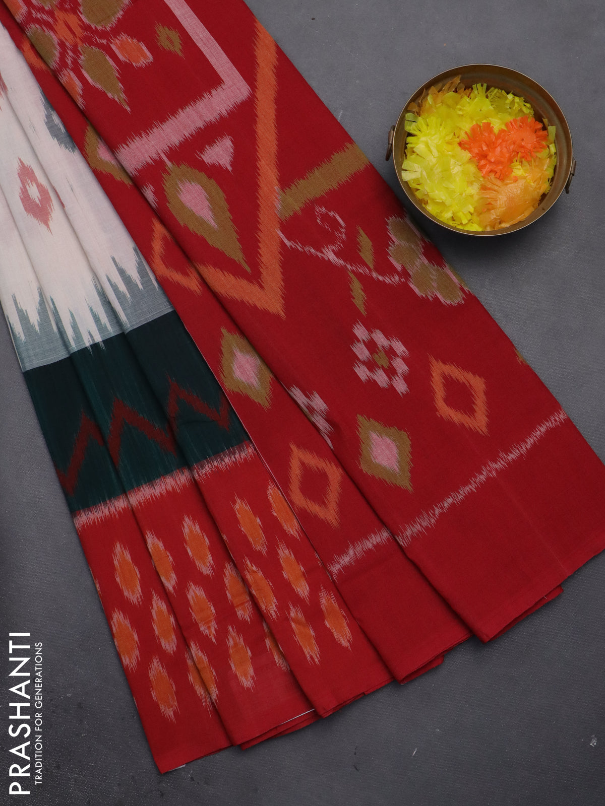 Ikat cotton saree off white and peacock green red with allover ikat butta weaves and long ikat style border