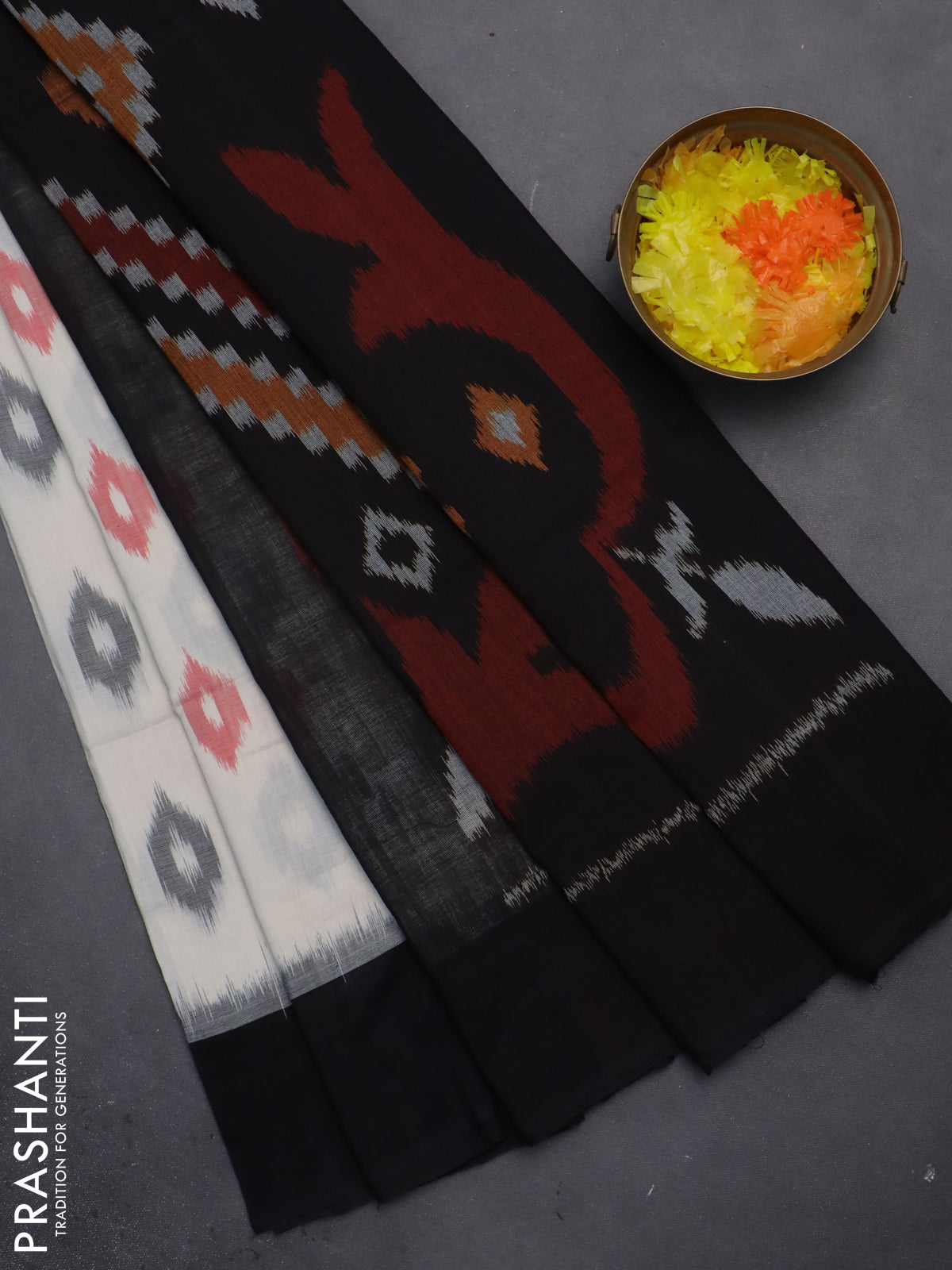 Ikat cotton saree off white and black with allover ikat butta weaves and long ikat style border