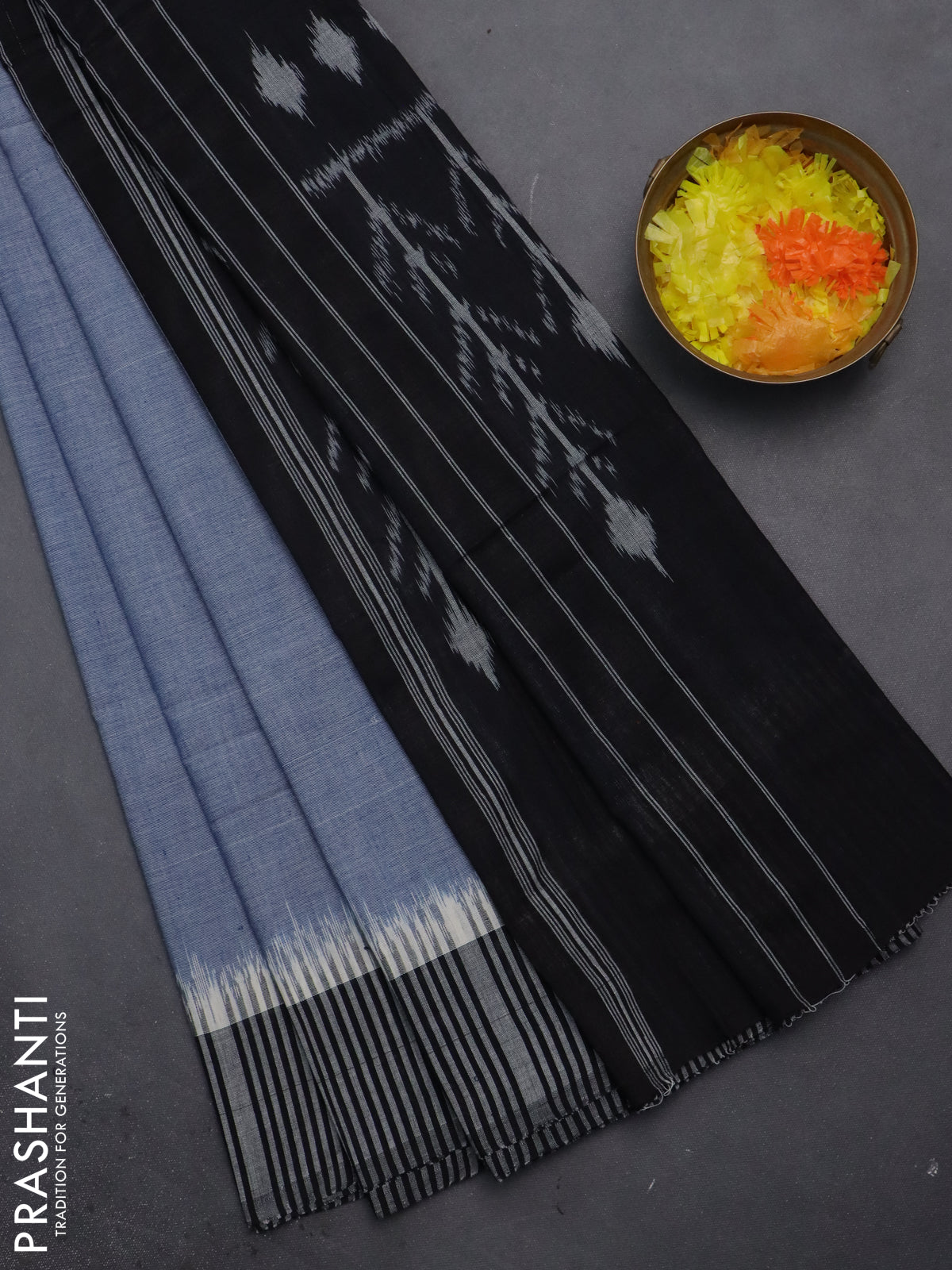 Ikat cotton saree bluish grey and black with plain body and simple border