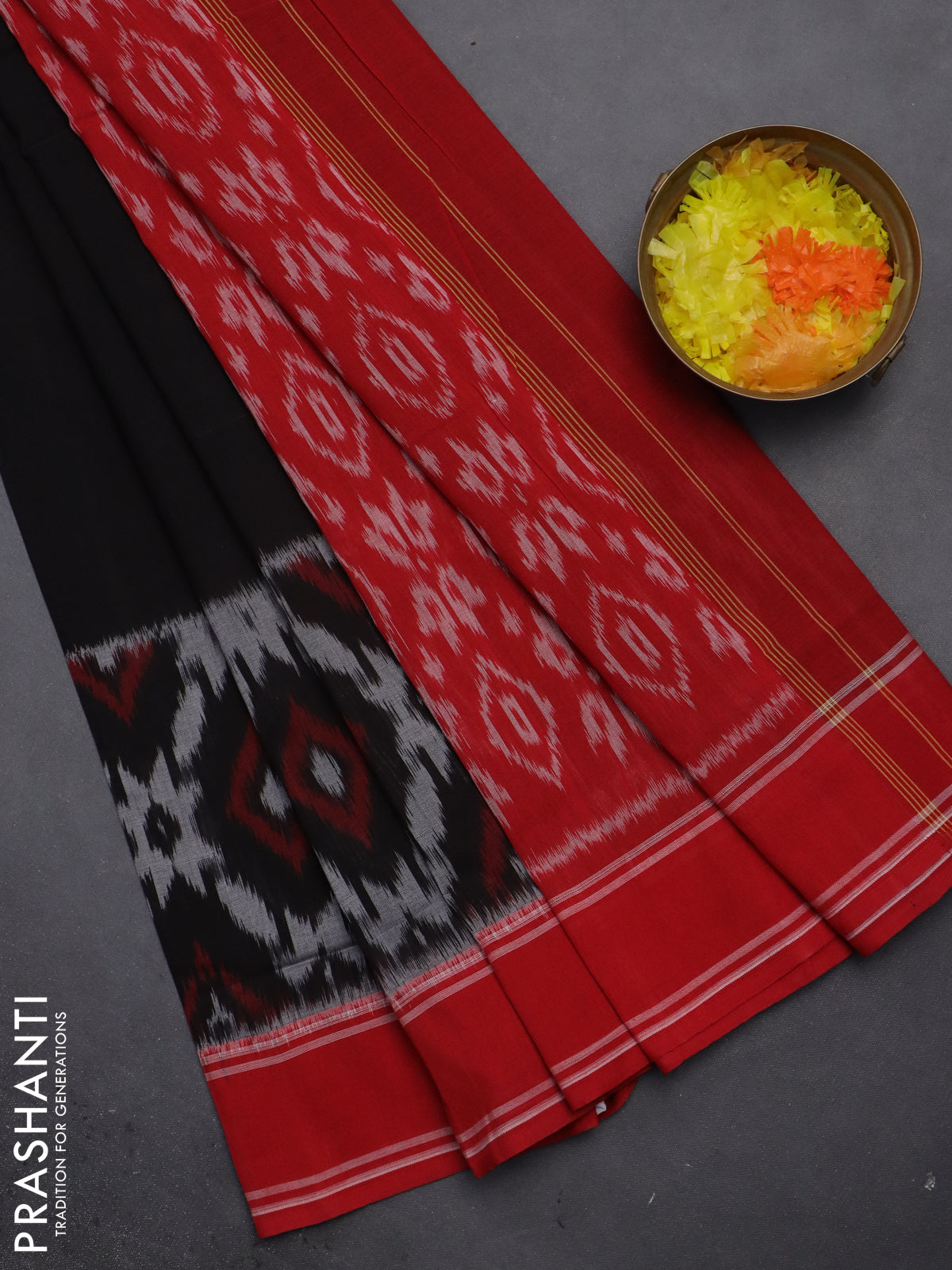 Ikat cotton saree black and red with plain body and rettapet zari woven border