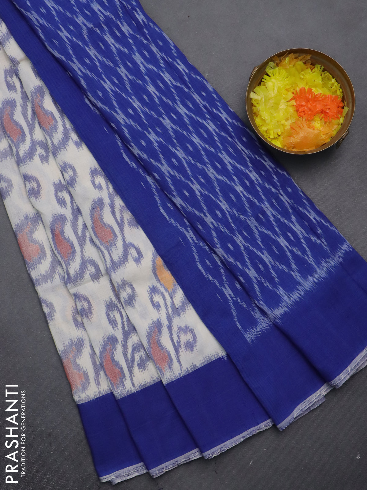 Ikat cotton saree off white and blue with allover ikat weaves and simple border