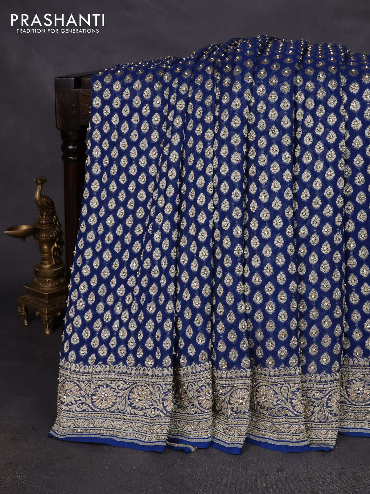 Banarasi georgette saree peacock blue with woven buttas & stone work and zardosi work border