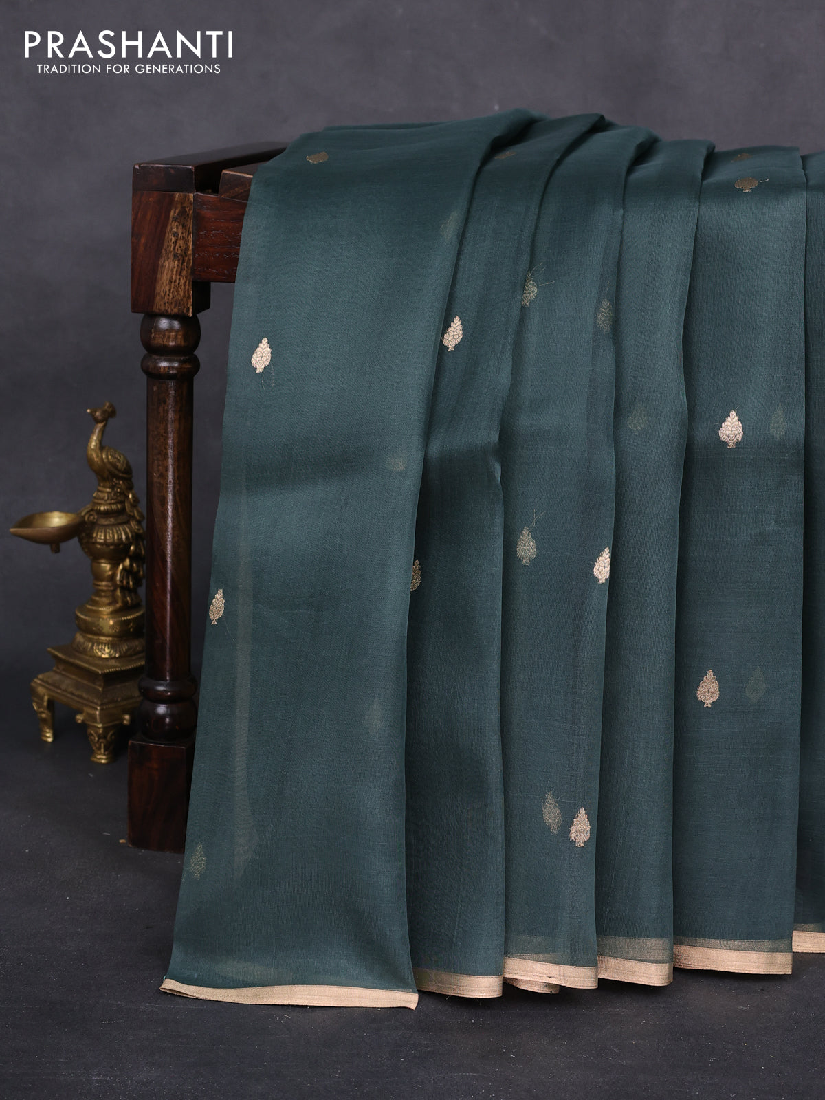Banarasi organza silk saree greyish green with zari woven buttas and zari woven piping border