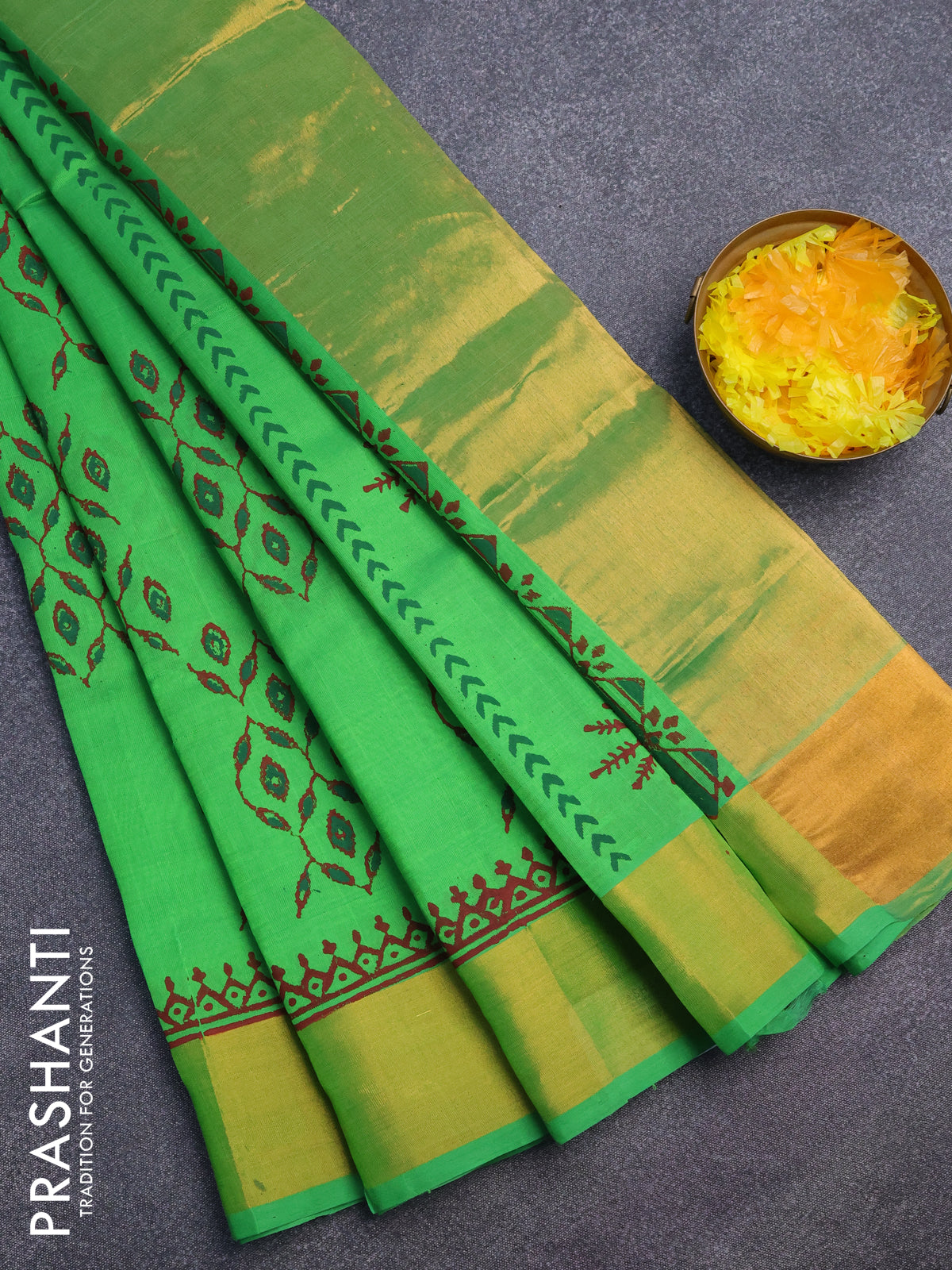 Silk cotton block printed saree green with allover prints and zari woven border