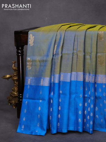 Pure uppada silk saree dual shade of bluish light green and cs blue with silver zari woven buttas and long silver zari woven butta border