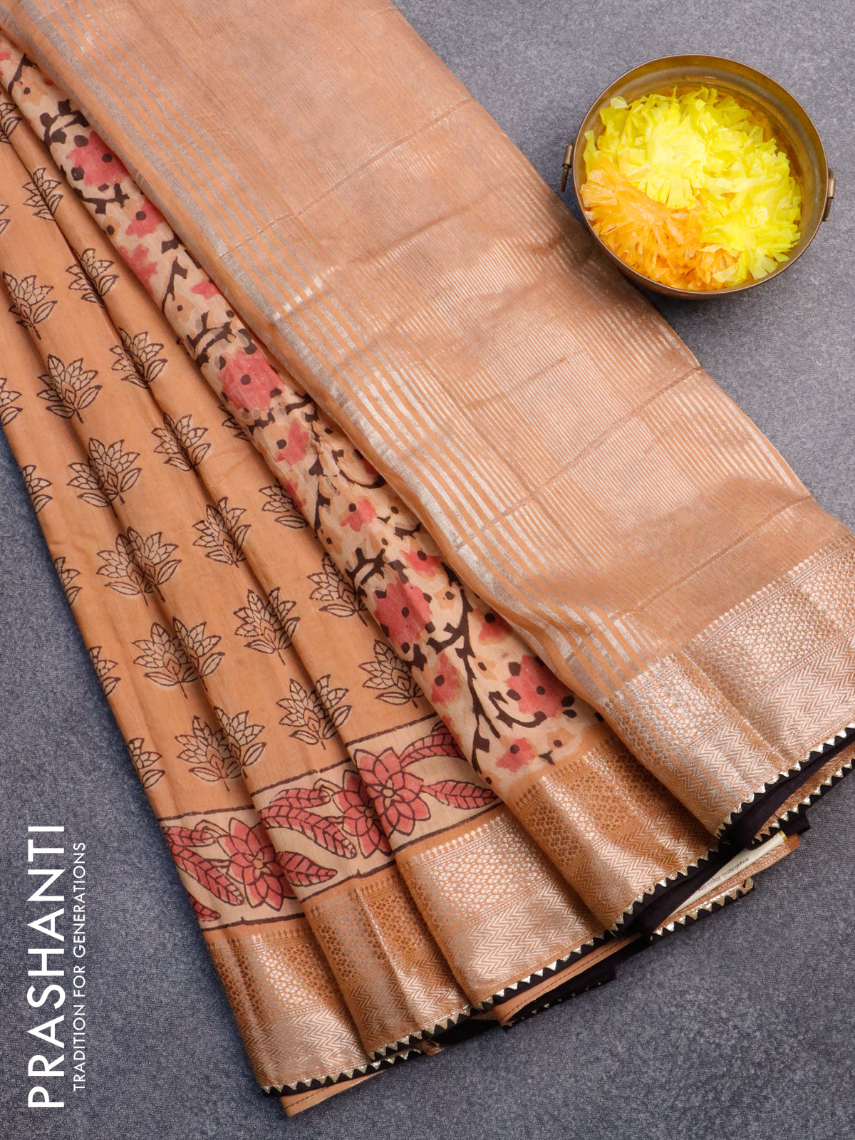 Chanderi silk cotton saree pale orange and black with natural vegetable butta prints and zari woven gotapatti lace border