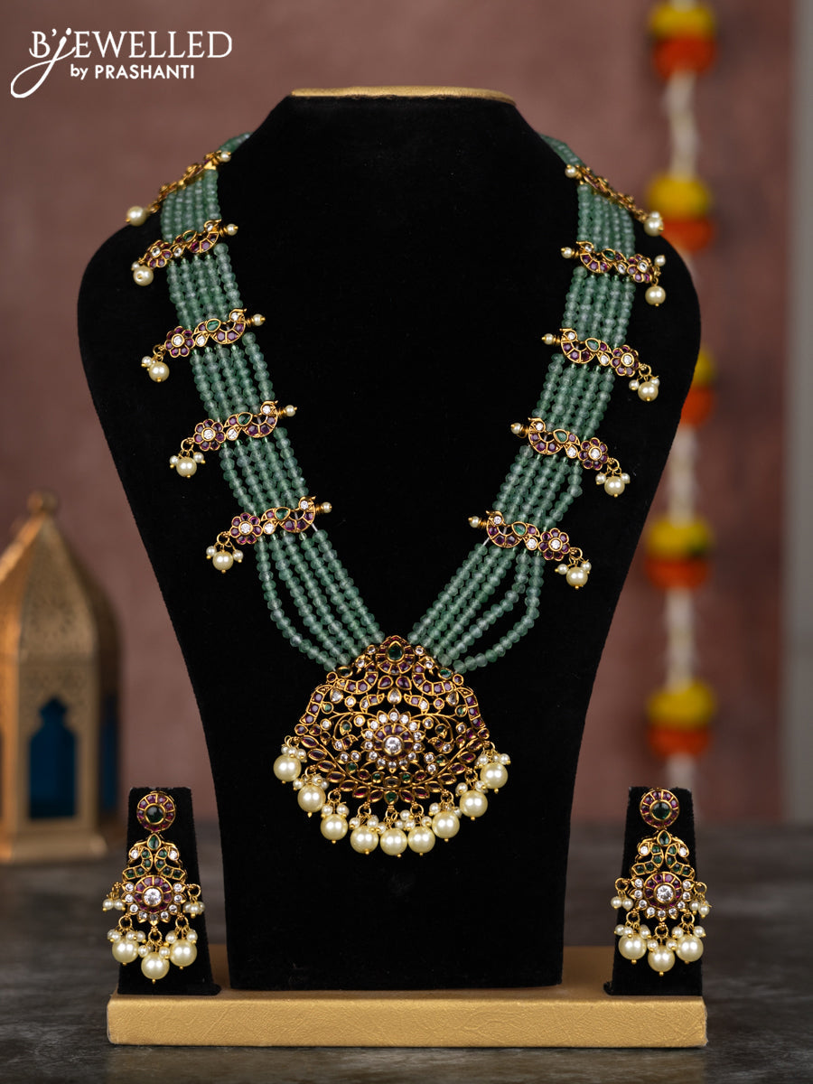 Beaded multilayer mint green necklace with kemp & cz stones and pearl hangings in victorian finish