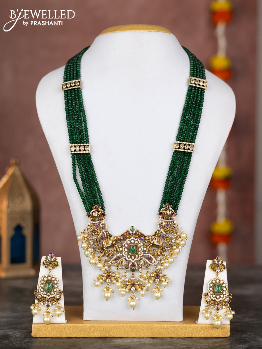Beaded multilayer green necklace elephant design with kemp & cz stones and pearl hangings in victorian finish