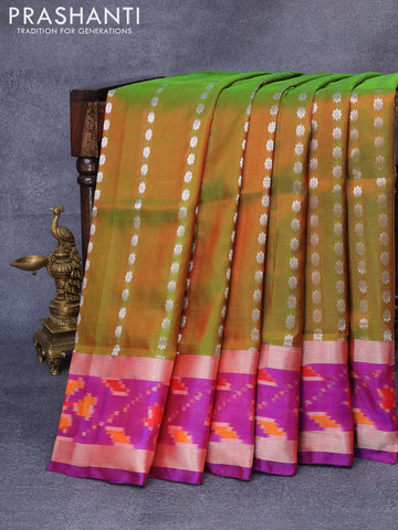 Pure uppada silk saree dual shade of greenish maroon and dual shade of purple with allover silver zari woven floral buttas and silver zari woven ikat style border