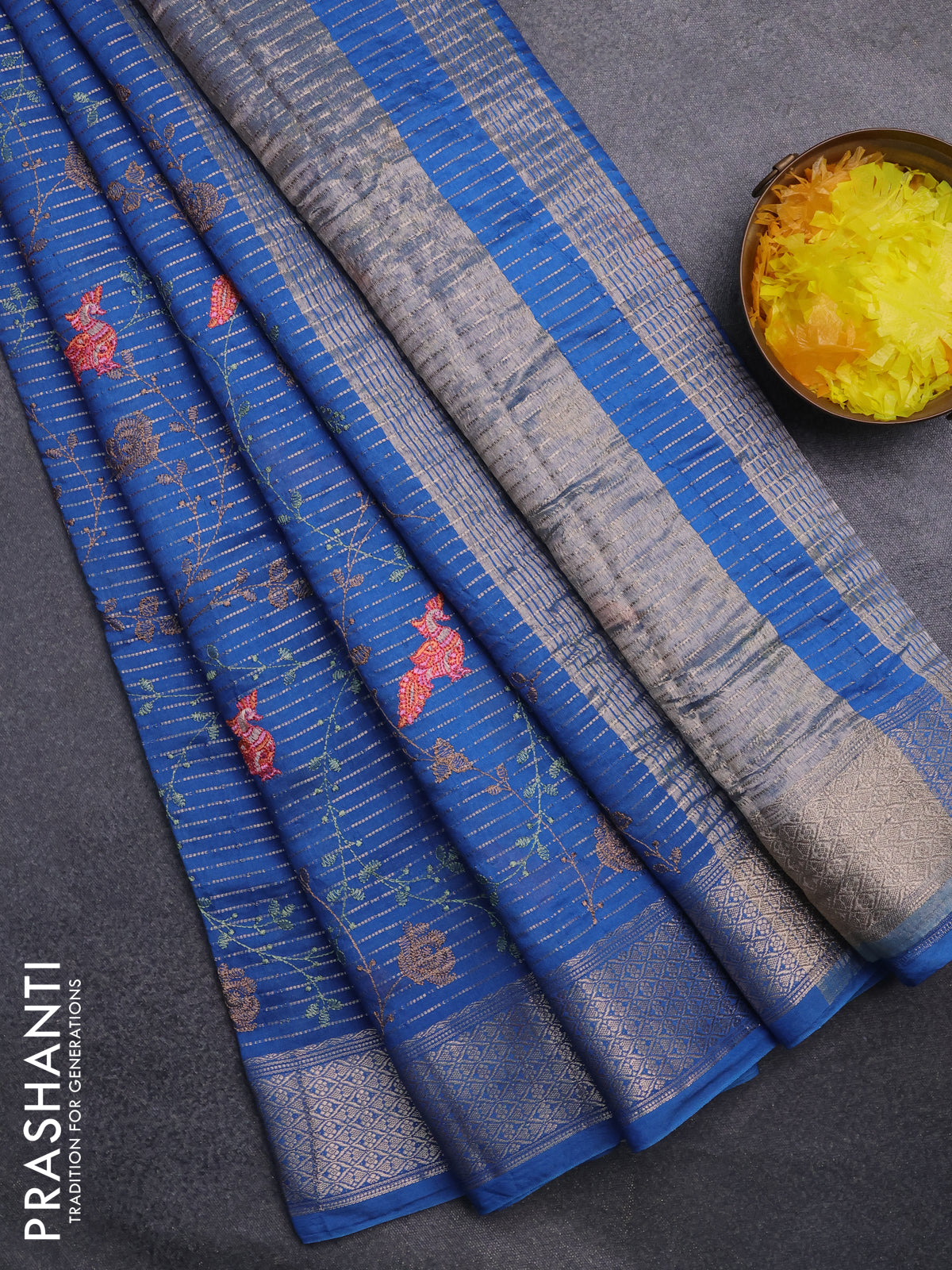 Assam silk saree cs blue with allover zari weaves & embroidery work and zari woven border