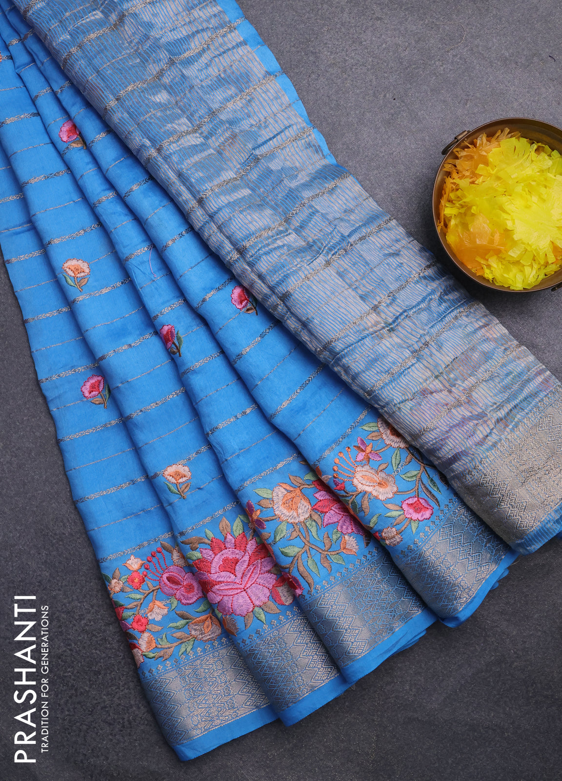 Assam silk saree light blue with allover zari weaves & floral embroidery work buttas and zari woven border