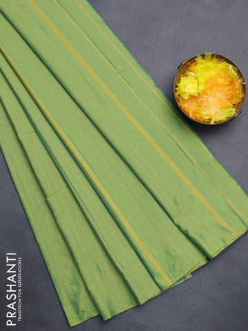 Arani semi silk saree light green with allover copper zari weaves in borderless style