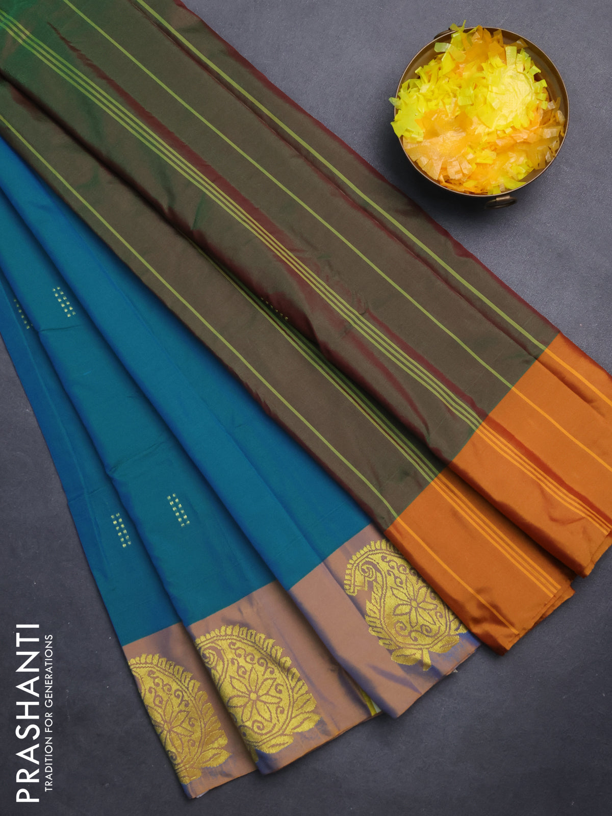 Arani semi silk saree teal blue shade and dual shade of mustard with zari woven buttas and paisley zari woven butta border