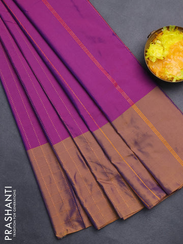 Arani semi silk saree purple and rust shade with allover copper zari weaves and zari checked border