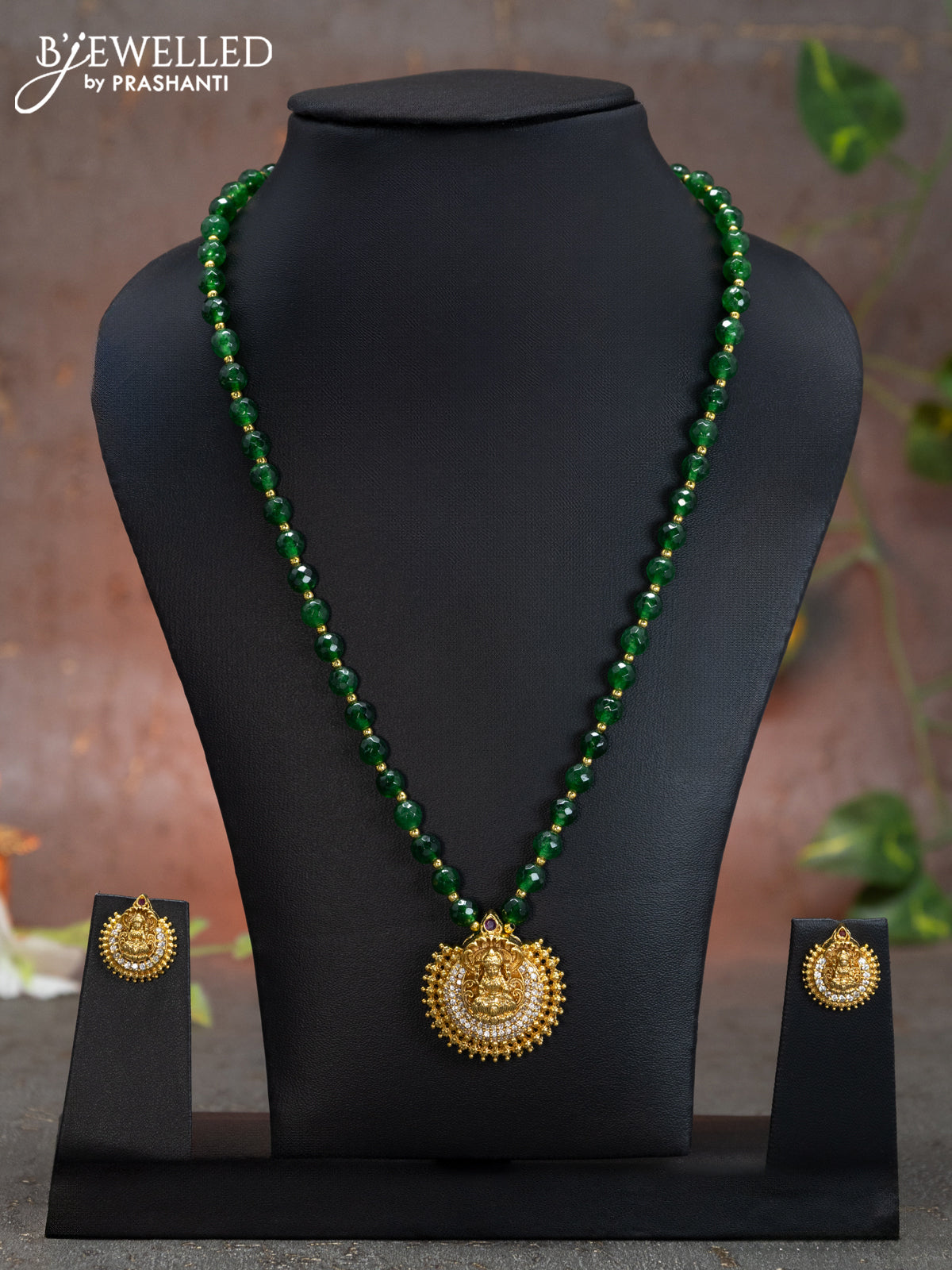 Beaded green necklace with cz stones and lakshmi pendant