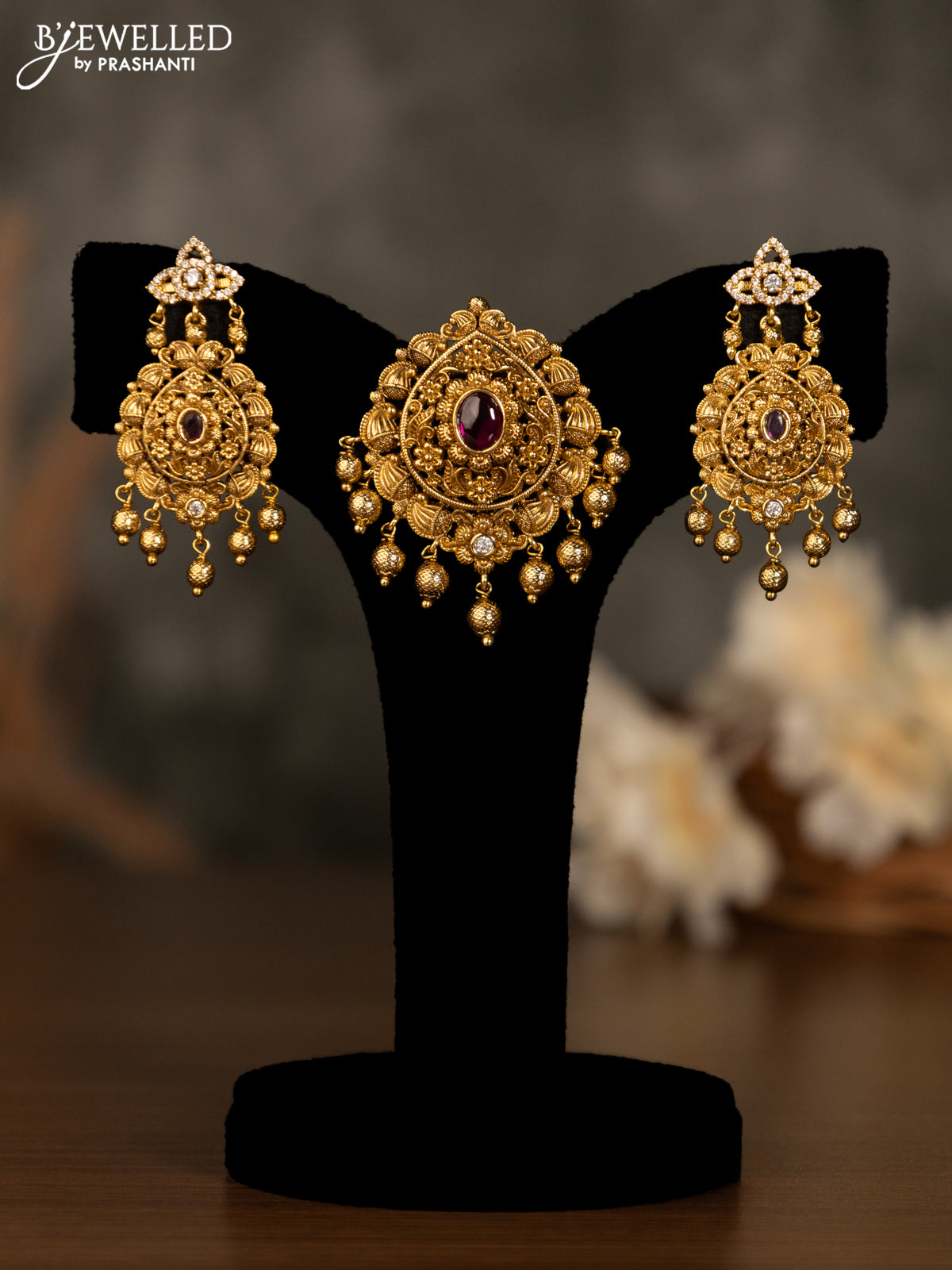 Antique pendant set with pink kemp & cz stones and golden beads hanging