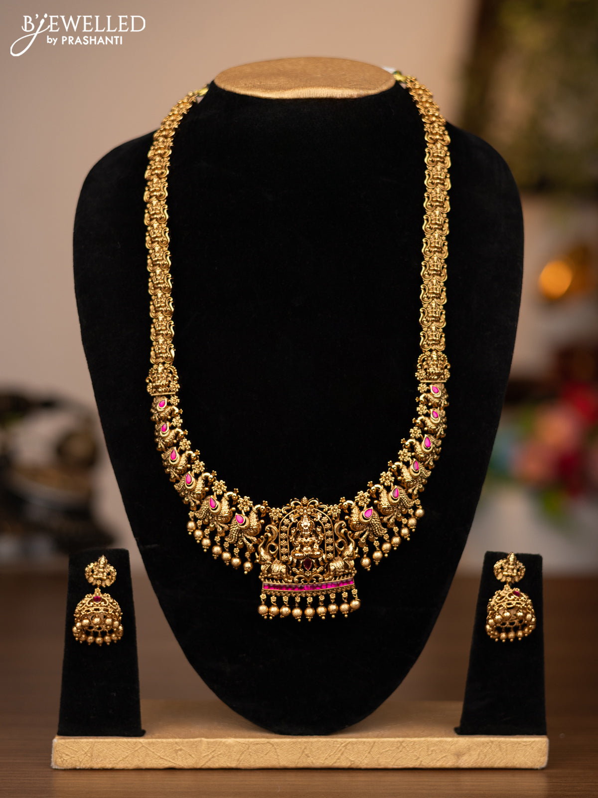 Antique haaram lakshmi design with pink jadau stones and golden beads hanging
