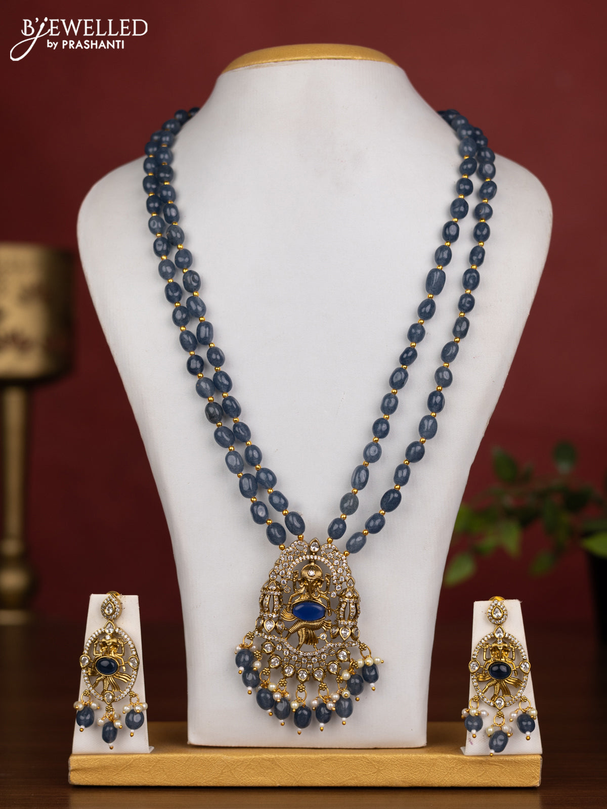 Beaded double layer blue necklace ganesha pendant with sapphire & cz stones and pearl & beads hanging in victorian finish