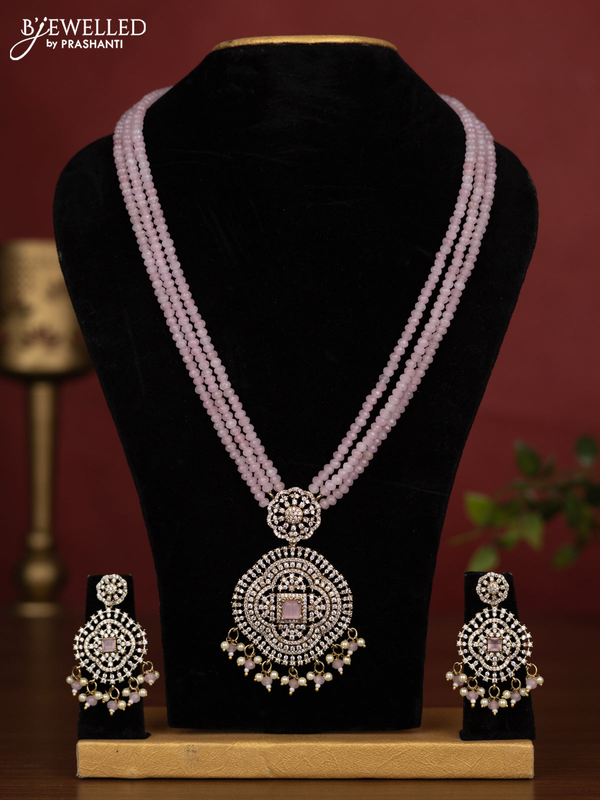 Beaded triple layer baby pink necklace with cz stones and pearl & beads hanging in victorian finish