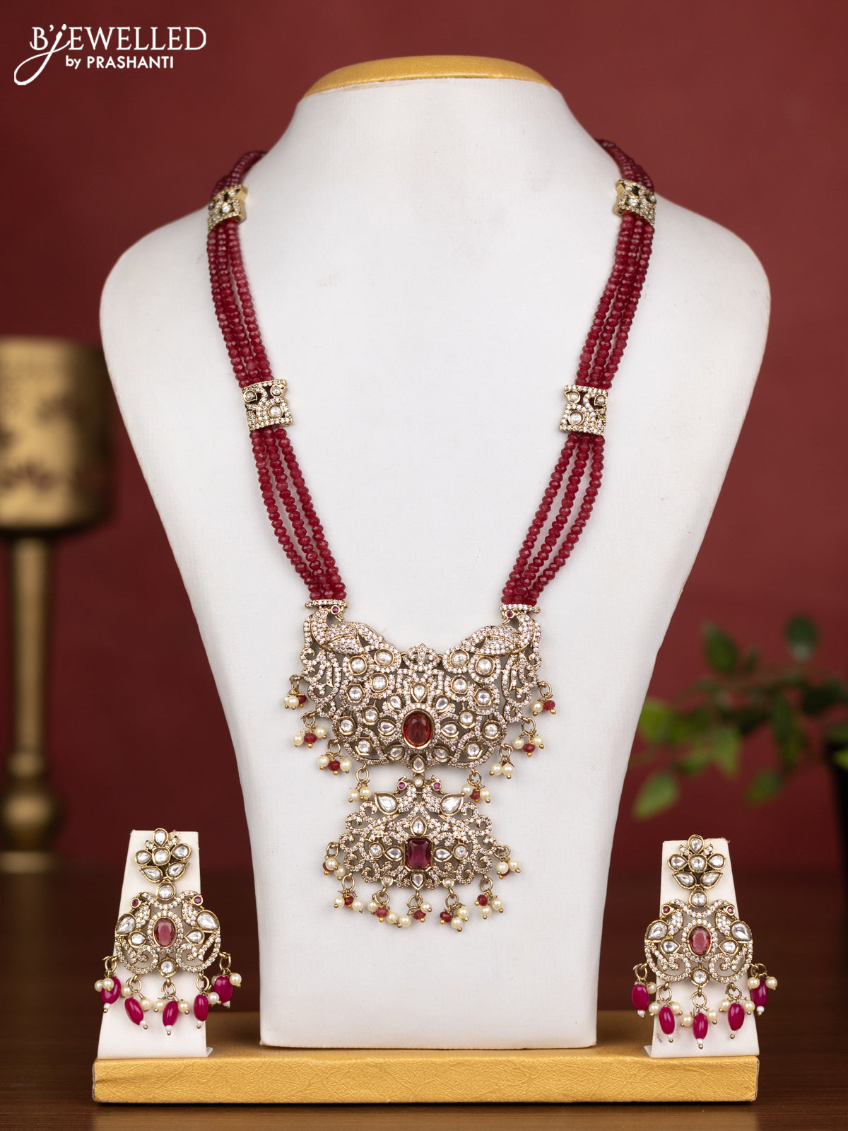 Beaded triple layer maroon necklace peacock design with ruby kundan & cz stones and pearl & beads hanging
