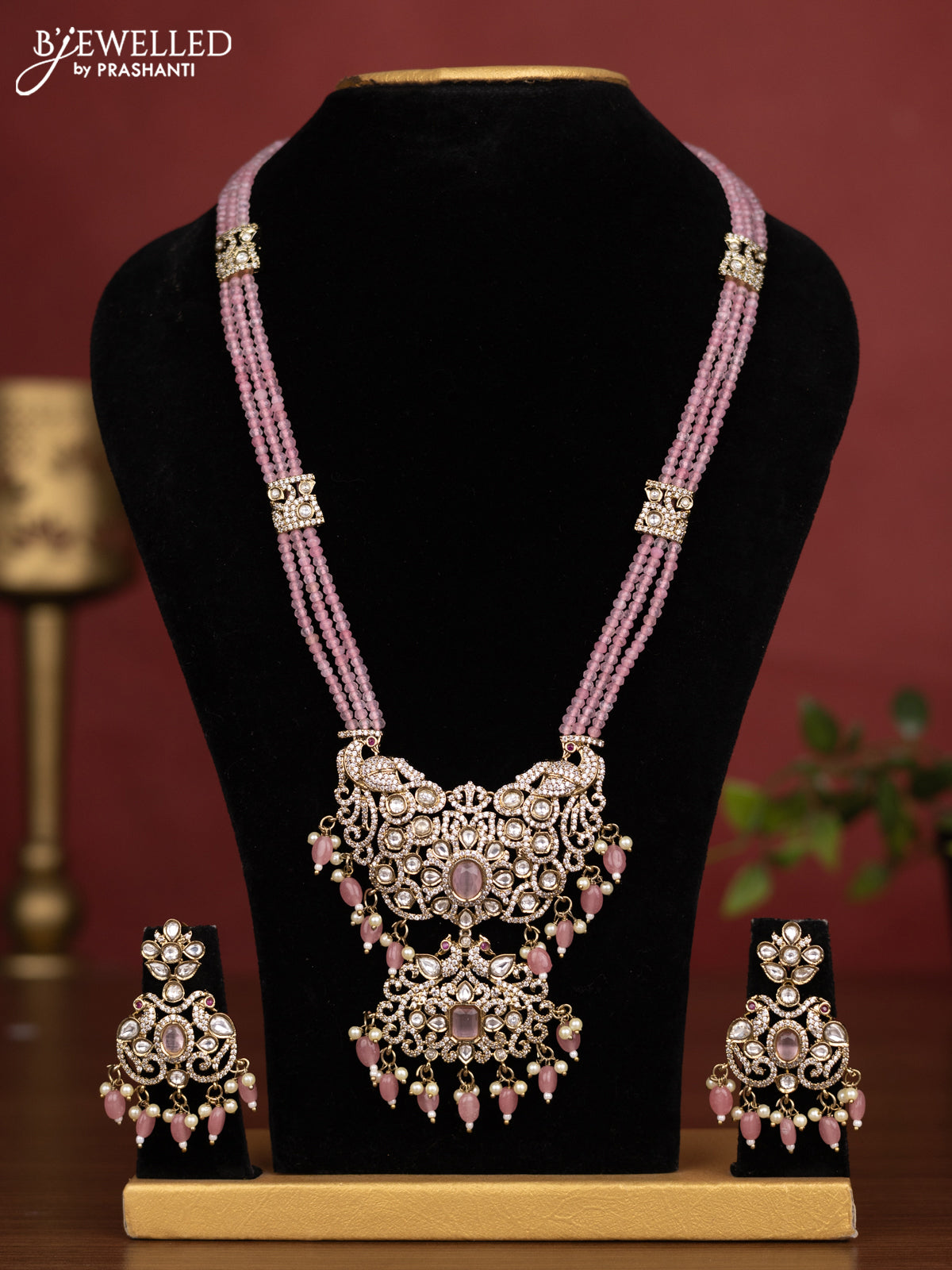 Beaded triple layer baby pink necklace peacock design with kundan & cz stones and pearl & beads hanging