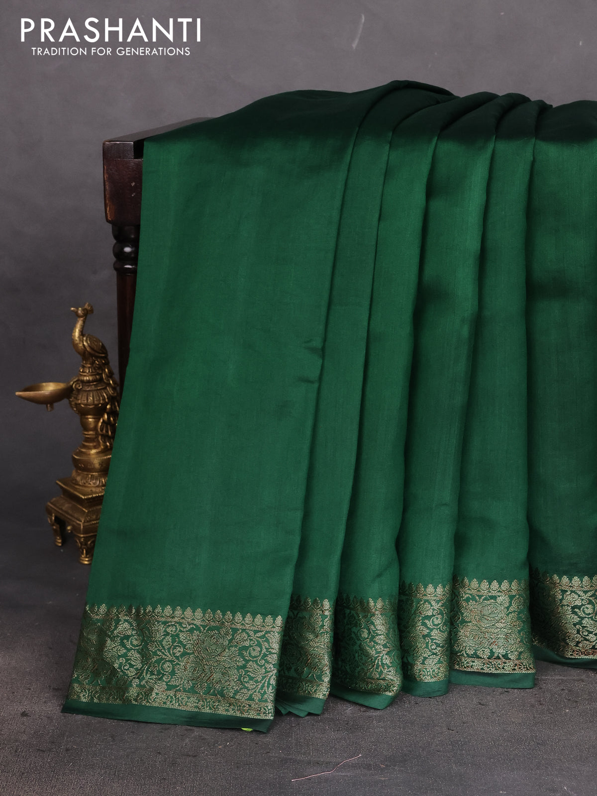 Chiniya silk saree dark green with plain body and woven border