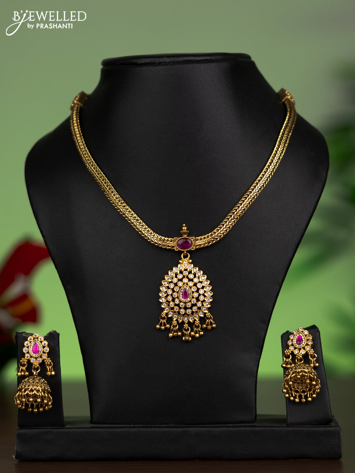 Jadau attigai necklace with pink jadau & cz stones and golden beads hanging