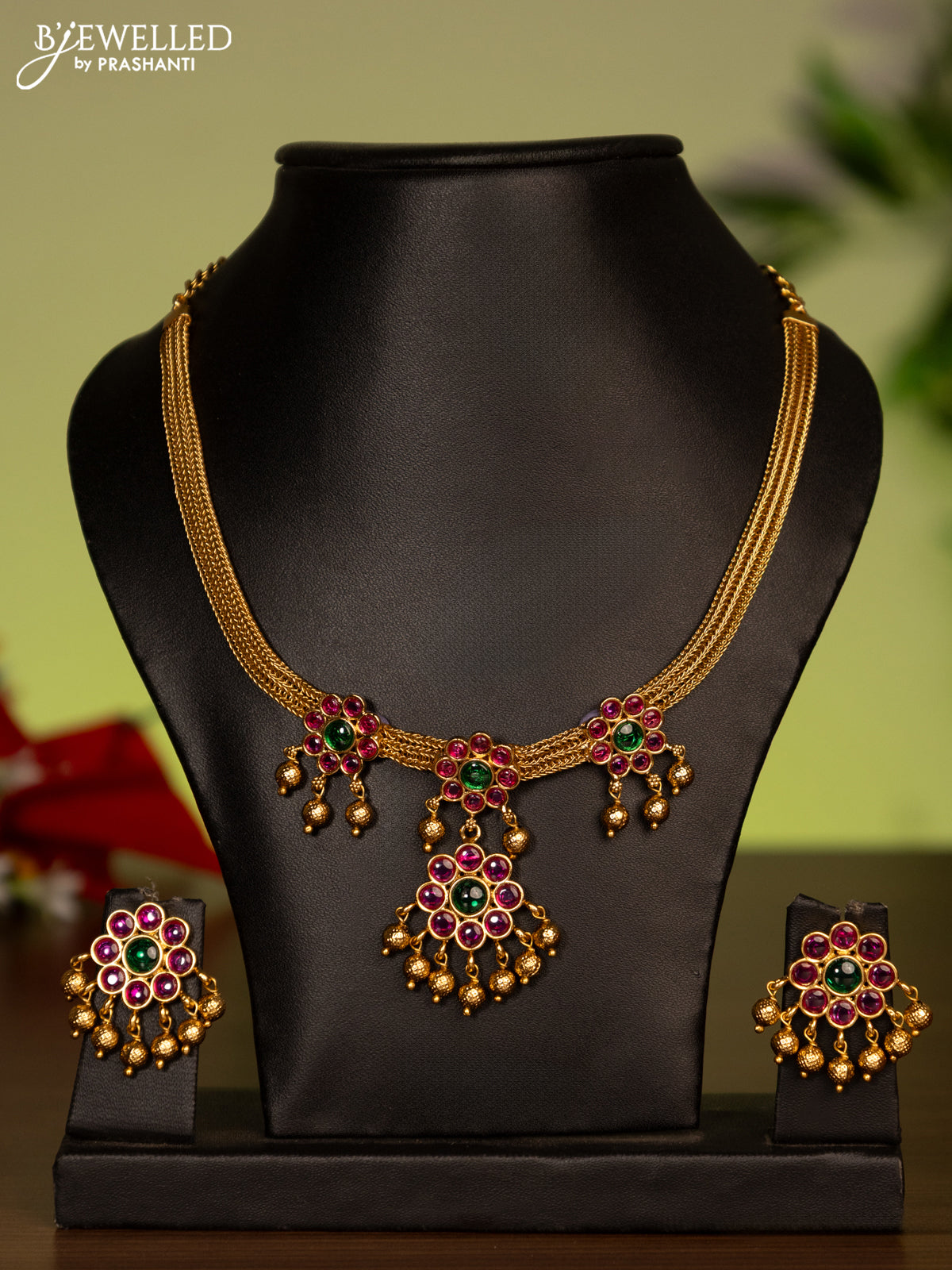 Antique attigai necklace with kemp stones and golden beads hanging