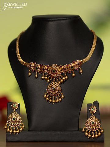 Antique attigai necklace with kemp stones and golden beads hanging