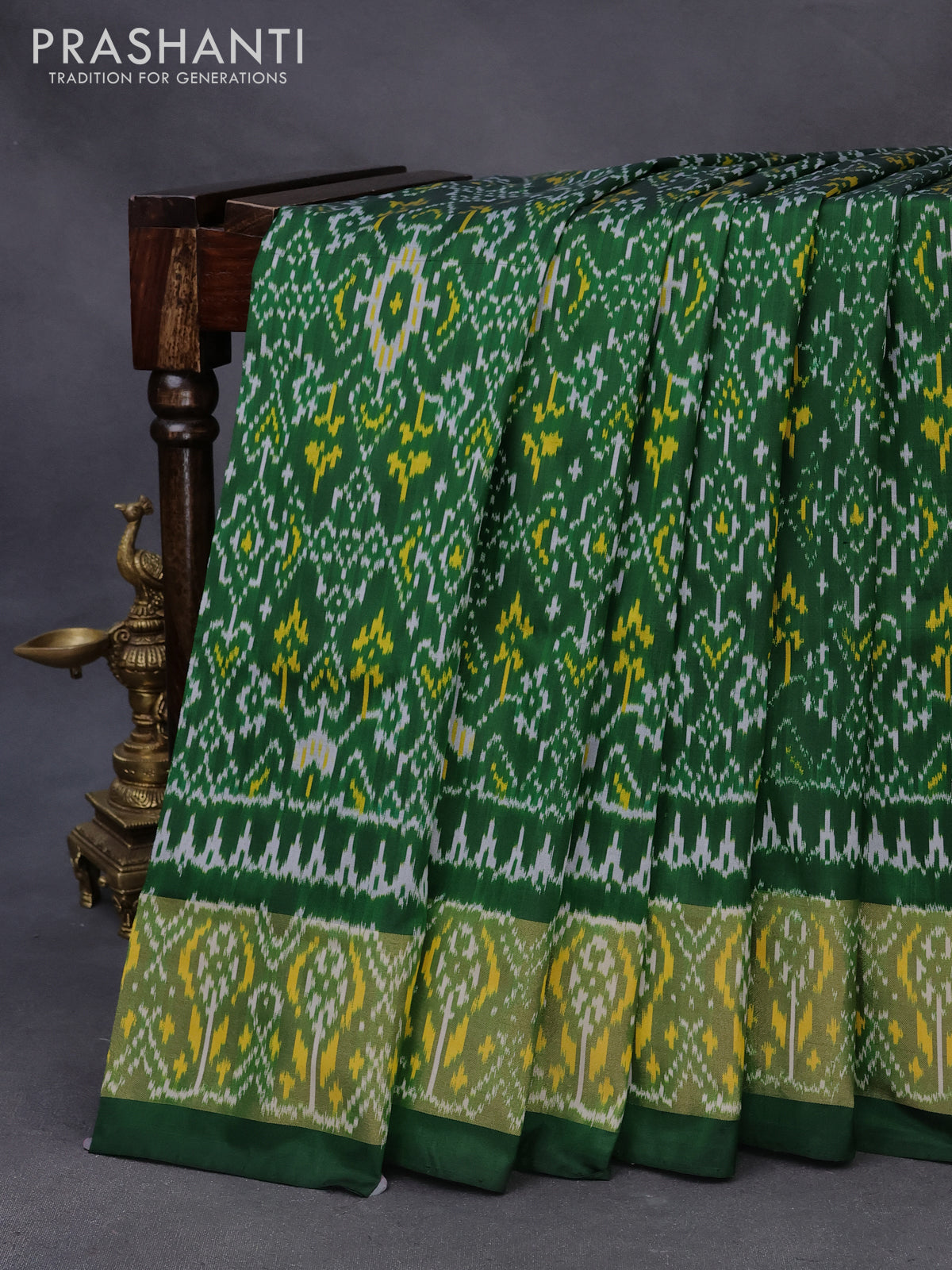 Pochampally silk saree green with allover ikat weaves and ikat woven zari border