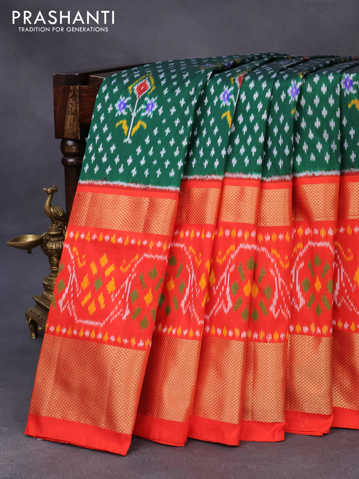 Pochampally silk saree green and orange with allover ikat weaves and long zari woven ikat border