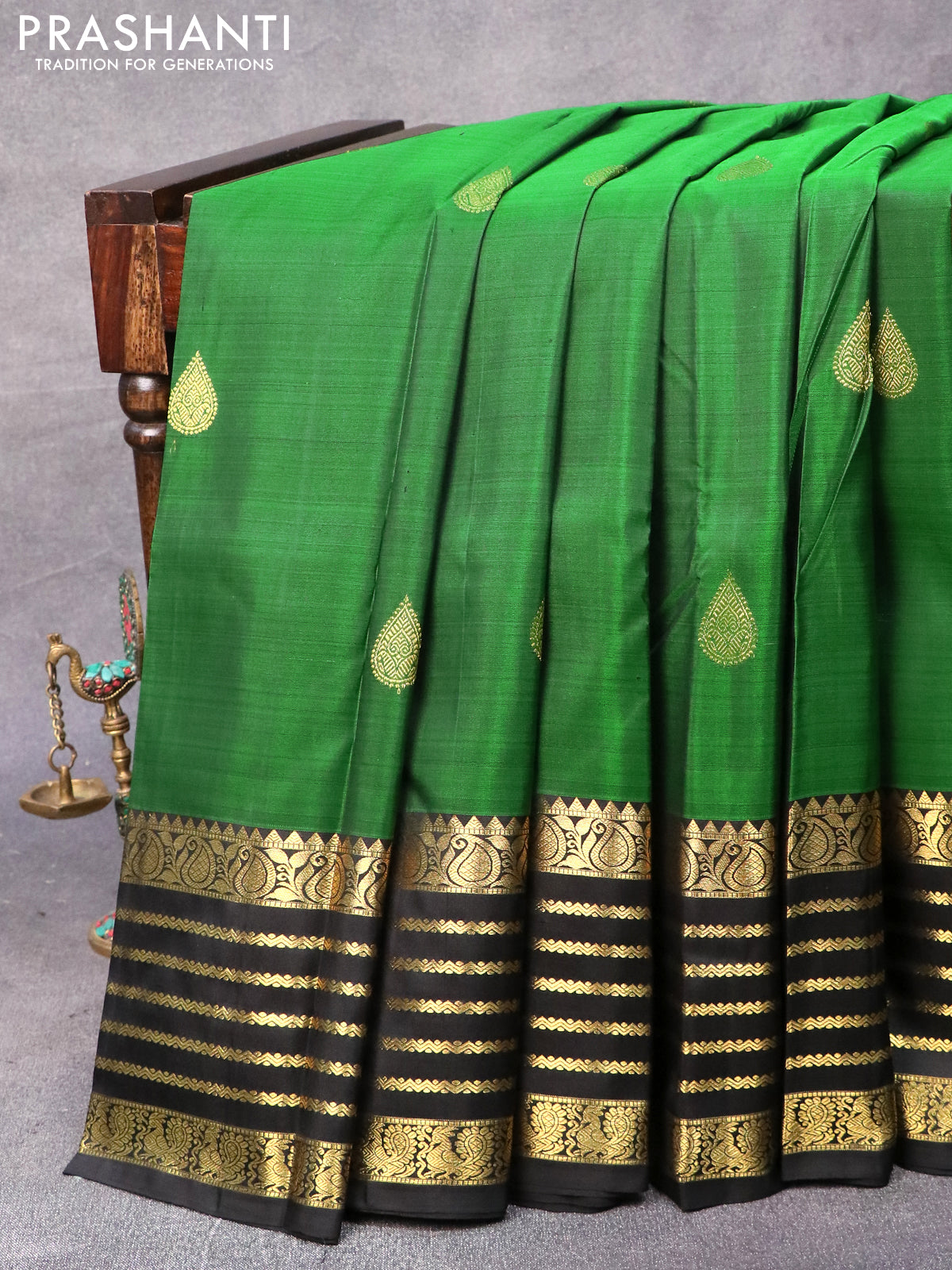 Pure kanjivaram silk saree green and black with zari woven buttas and zari woven border & butta style