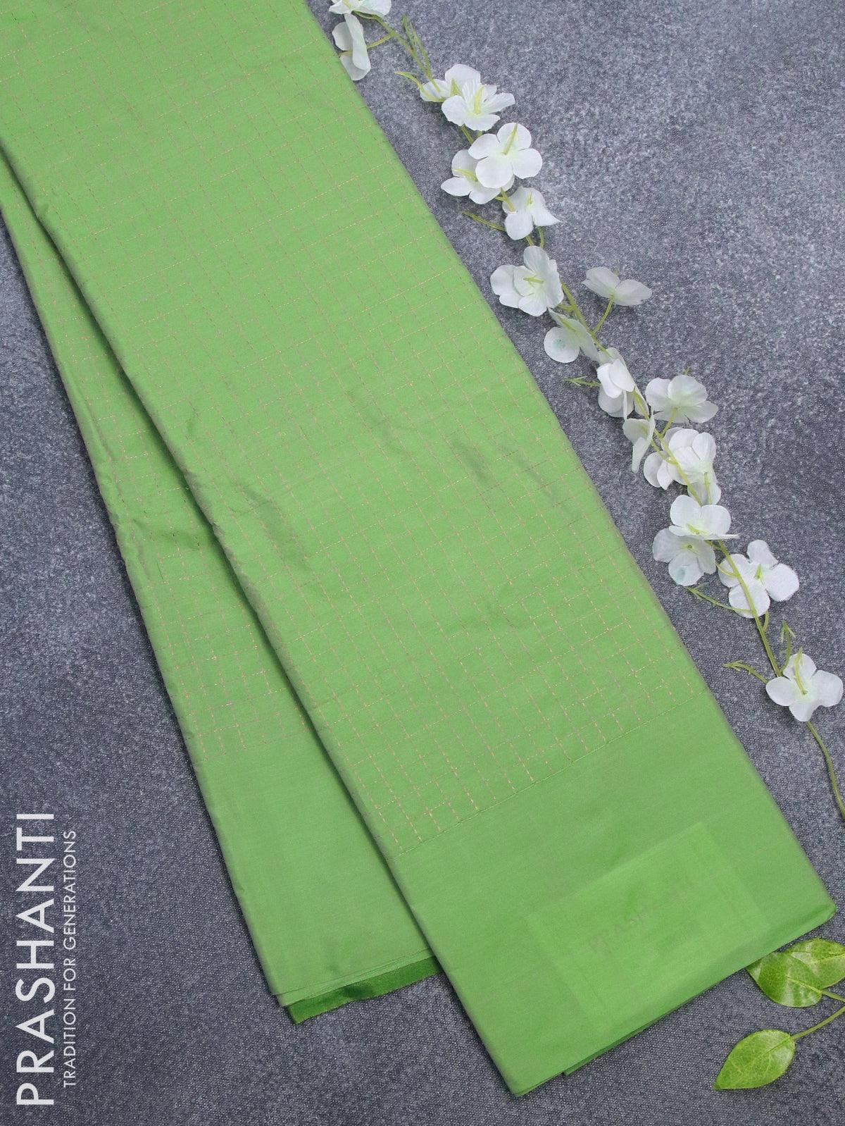 Arani semi silk saree light green and green with allover copper zari checked pattern and simple border