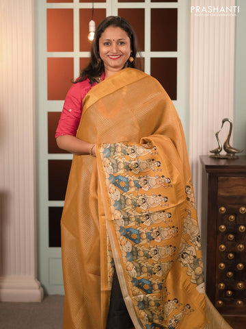 Banarasi tissue organza saree mustard yellow with plain body and kalamkari printed border