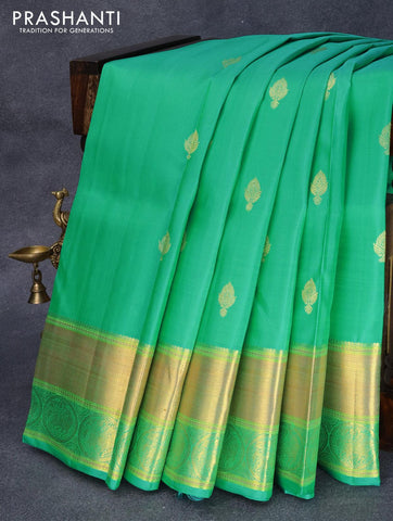 Pure kanjivaram silk saree dual shade of teal green with zari woven buttas and rich zari woven border Butta style