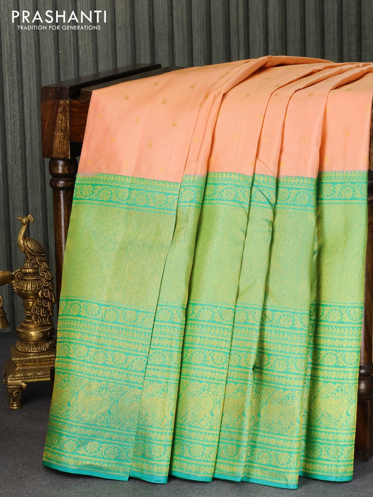 Pure kanjivaram silk saree peach shade and teal blue shade with allover zari woven buttas and long rich zari woven border