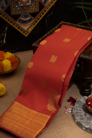 Kancheepuram Silk Peacock Buttis Brick Red Saree